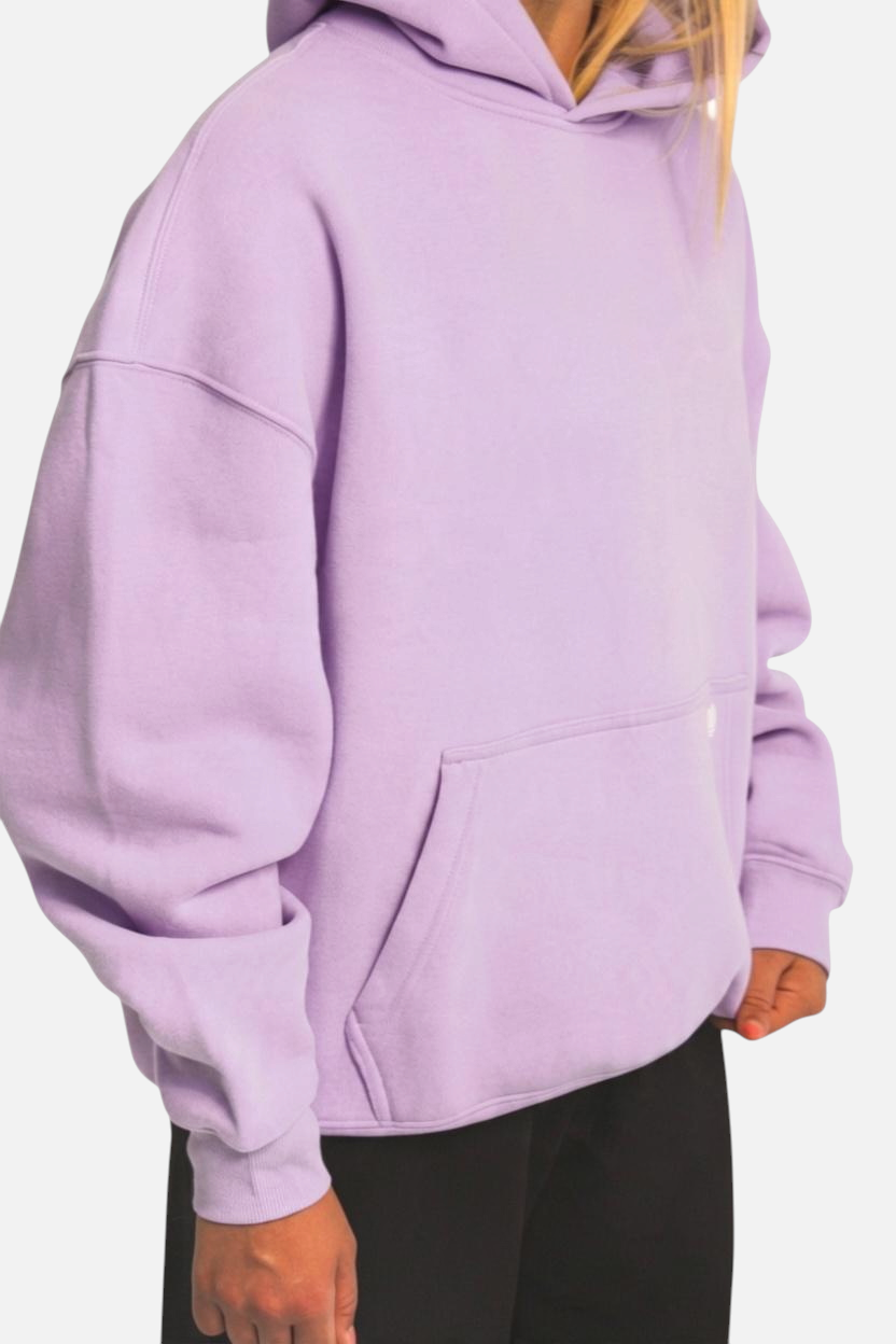 noora lavender brushed fleece hoodie with a boxy fit, front pocket, and hood worn by a model