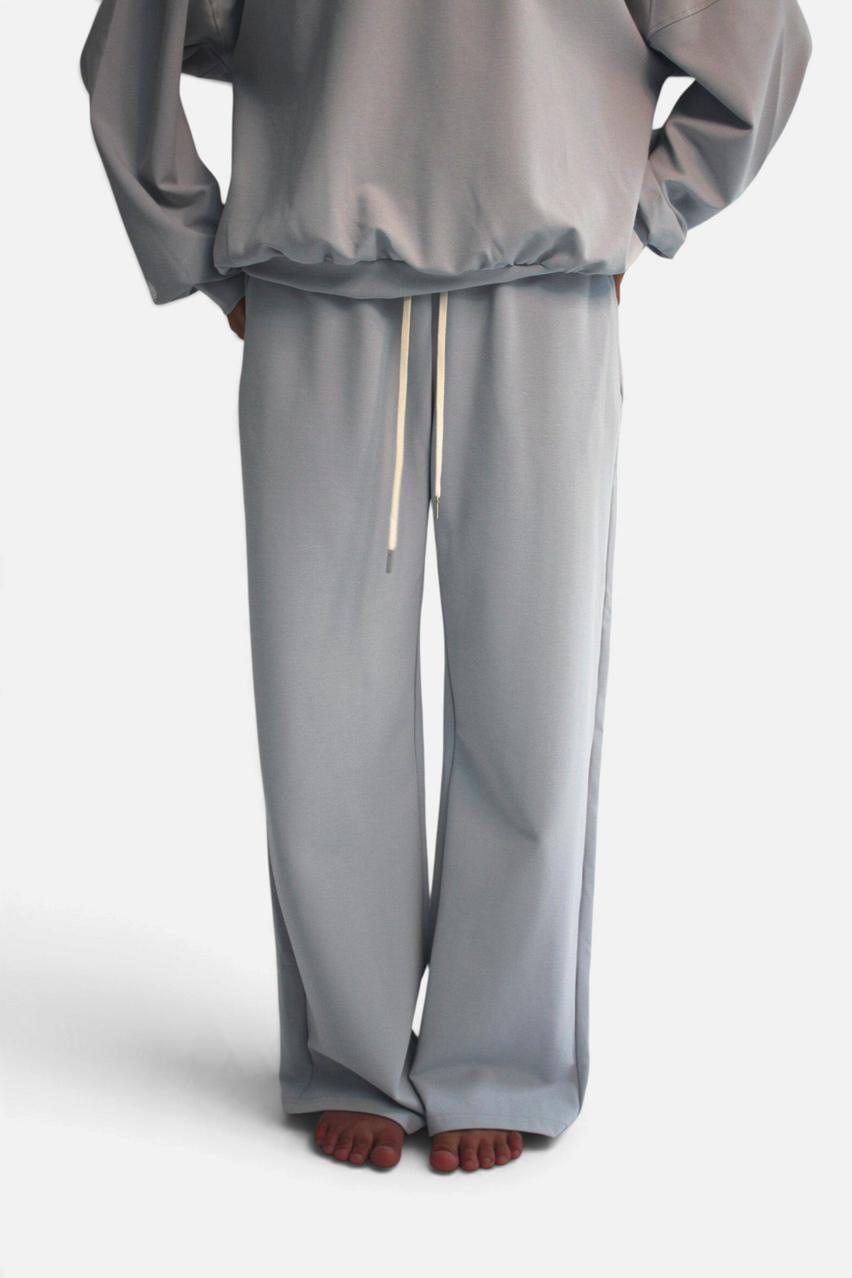 noora straight fit joggers in light blue cotton blend with an adjustable drawstring waistband on a model