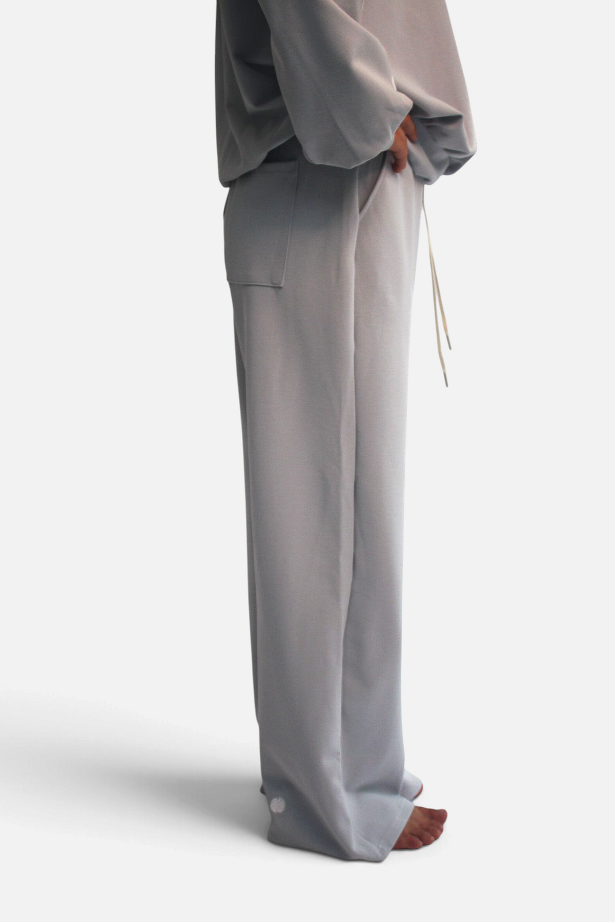 noora straight fit joggers in light grey cotton blend with adjustable waistband and side pockets on a model