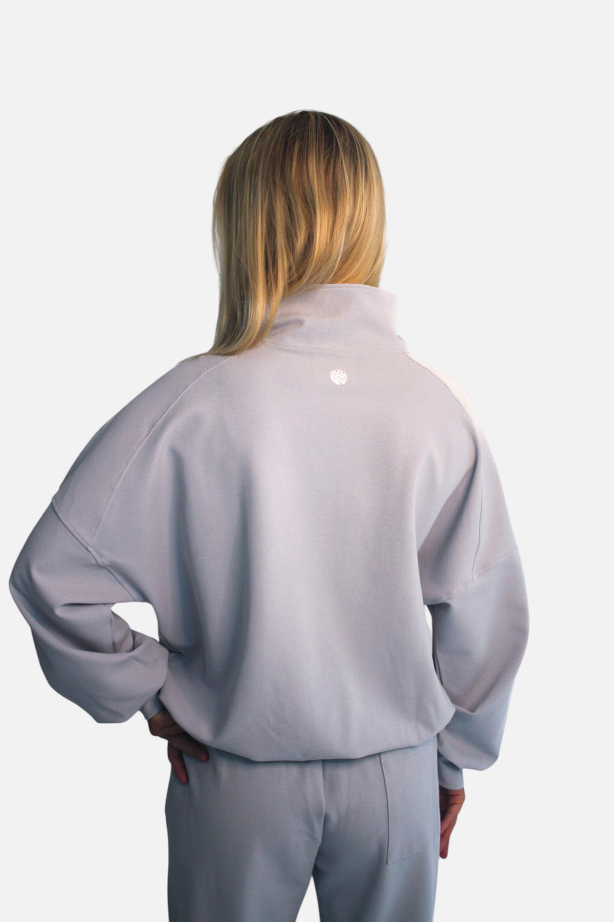 noora light grey 3/4 zip sweater with relaxed fit and crewneck worn by a model, back view